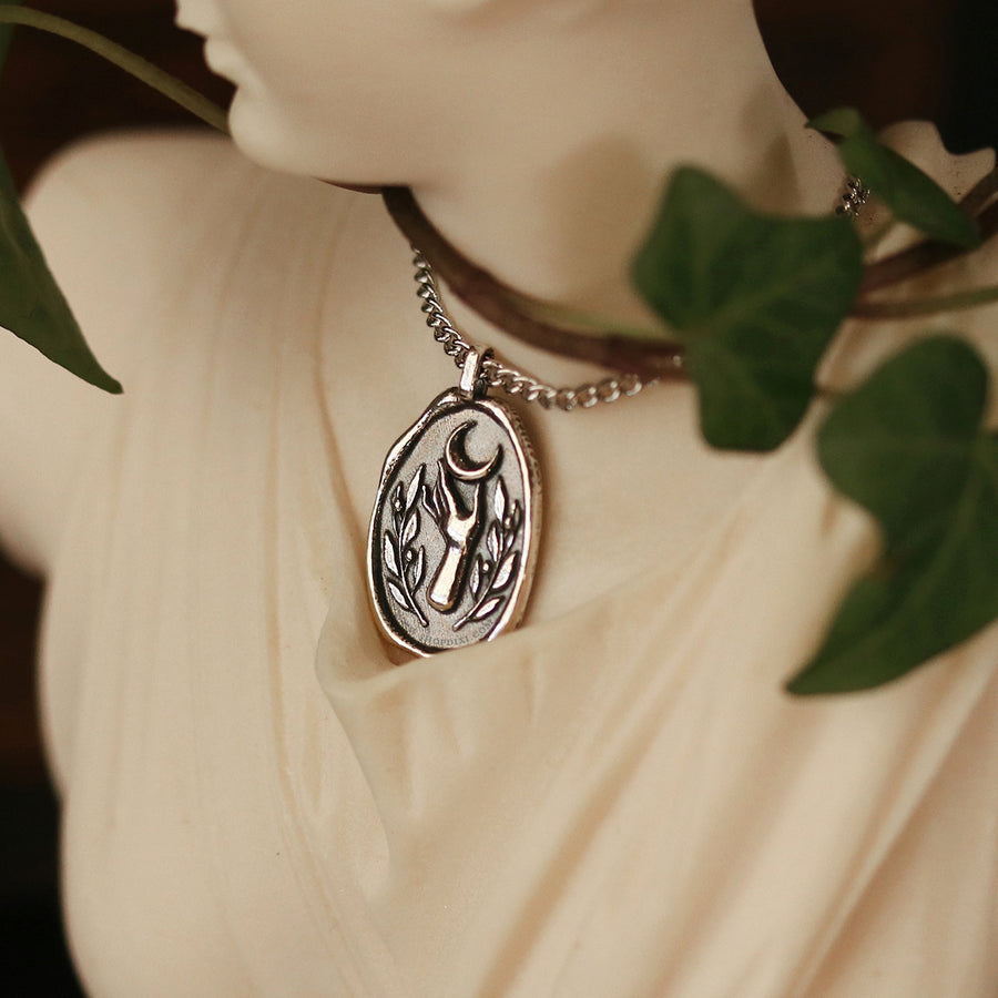 Goddess Selene inspired wax seal hand, olive leaf and crescent moon necklace.